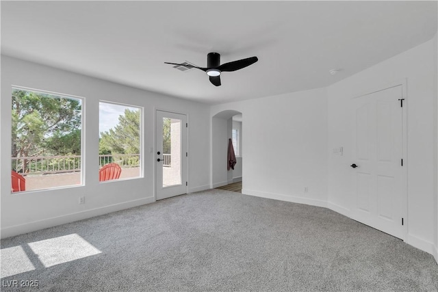 1551 Boundary Peak Way, Las Vegas, NV 89135 - empty room featuring arched walkways, carpet flooring, plenty of natural light, and ceiling fan