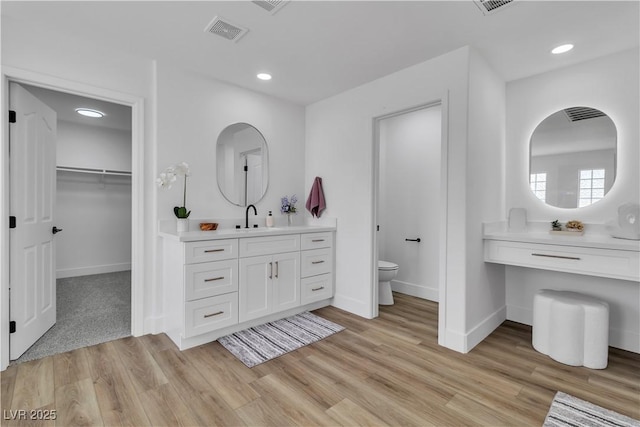 1551 Boundary Peak Way, Las Vegas, NV 89135 - full bath featuring wood finished floors, a spacious closet, recessed lighting, and vanity