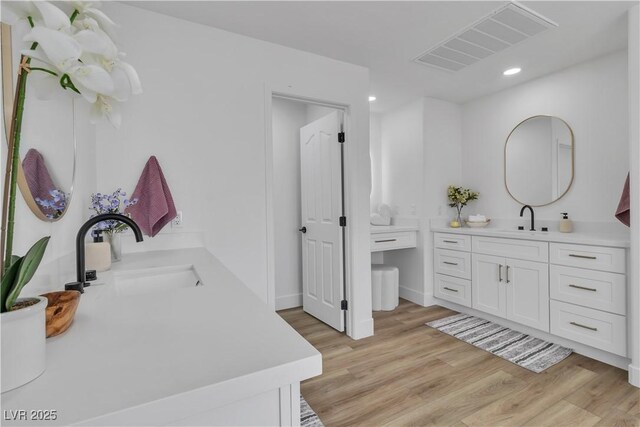 1551 Boundary Peak Way, Las Vegas, NV 89135 - bathroom with vanity, wood finished floors, and recessed lighting