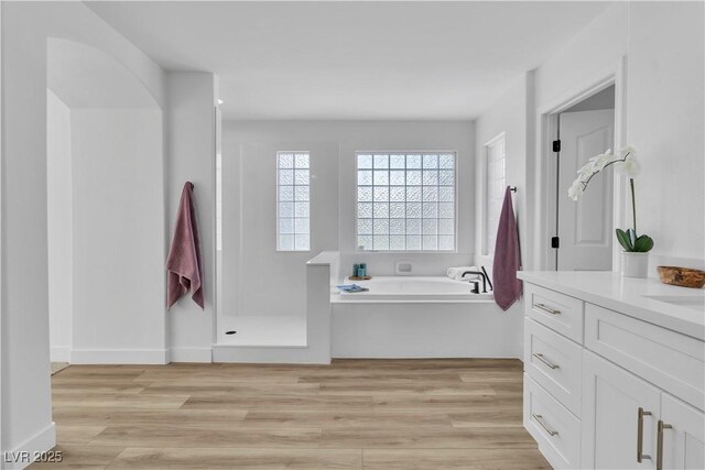 1551 Boundary Peak Way, Las Vegas, NV 89135 - full bath featuring vanity, a bath, wood finished floors, and walk in shower