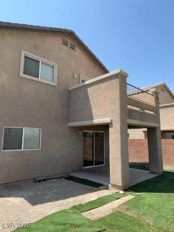 5316 Fireside Ranch Ave, Las Vegas, NV 89131 - back of property with a balcony, stucco siding, and a patio area