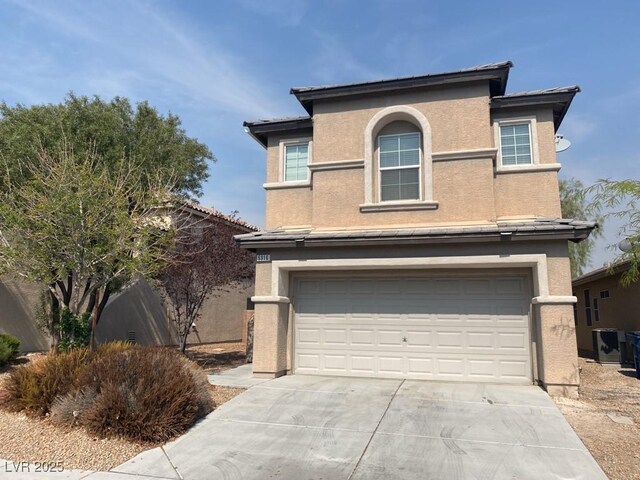 5316 Fireside Ranch Ave, Las Vegas, NV 89131 - traditional-style home with an attached garage, stucco siding, and concrete driveway