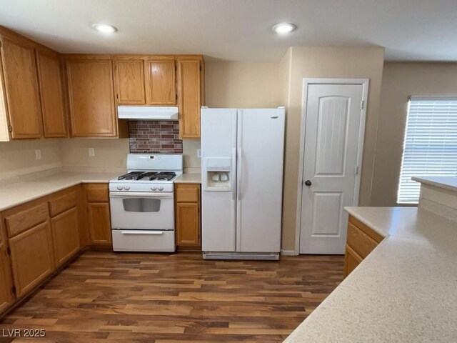 5316 Fireside Ranch Ave, Las Vegas, NV 89131 - kitchen featuring white appliances, under cabinet range hood, dark wood-style floors, light countertops, and recessed lighting