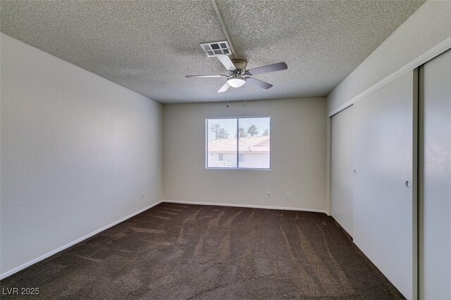 1013 Falconhead Ln Unit 202, Las Vegas, NV 89128 - unfurnished bedroom with carpet flooring, a closet, a textured ceiling, and ceiling fan
