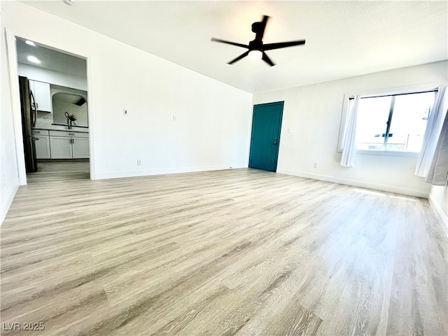 4324 El Conlon Ave, Las Vegas, NV 89102 - unfurnished living room featuring light wood finished floors and ceiling fan