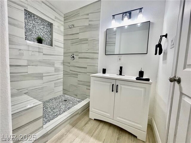 4324 El Conlon Ave, Las Vegas, NV 89102 - full bath featuring vanity, tiled shower, and wood finished floors
