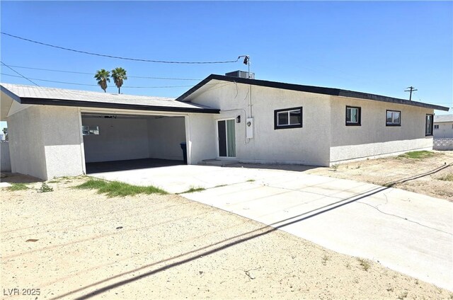 4324 El Conlon Ave, Las Vegas, NV 89102 - view of front of property featuring a garage, stucco siding, and concrete driveway