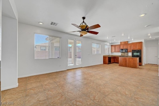 2261 Dalton Ridge Ct, North Las Vegas, NV 89031 - unfurnished living room with recessed lighting, ceiling fan, and light tile patterned floors