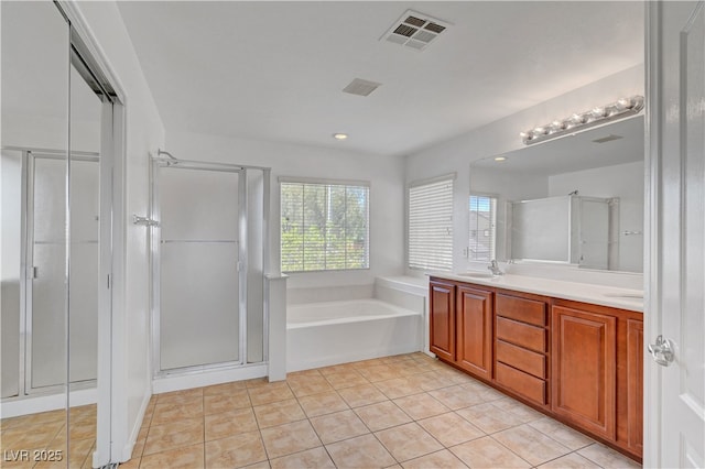 2261 Dalton Ridge Ct, North Las Vegas, NV 89031 - full bath featuring a garden tub, a shower stall, double vanity, and tile patterned flooring