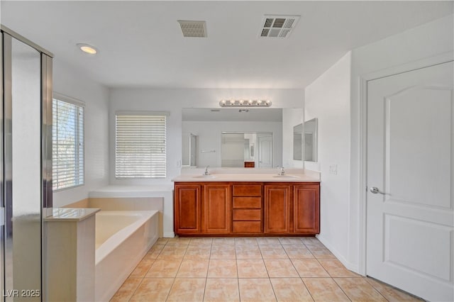 2261 Dalton Ridge Ct, North Las Vegas, NV 89031 - bathroom with a bath, double vanity, tile patterned flooring, and a shower with shower door