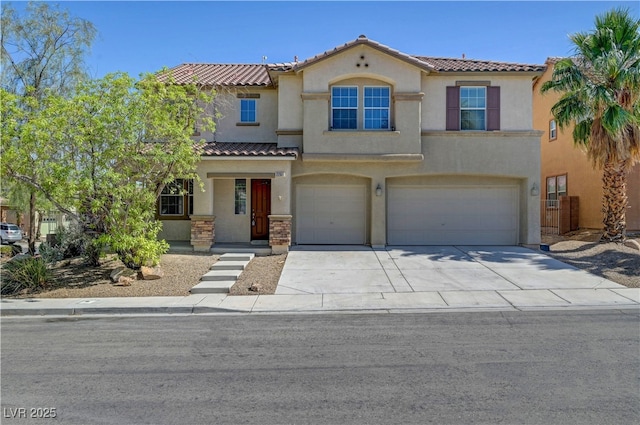 2261 Dalton Ridge Ct, North Las Vegas, NV 89031 - mediterranean / spanish home featuring stucco siding, an attached garage, a tile roof, and concrete driveway