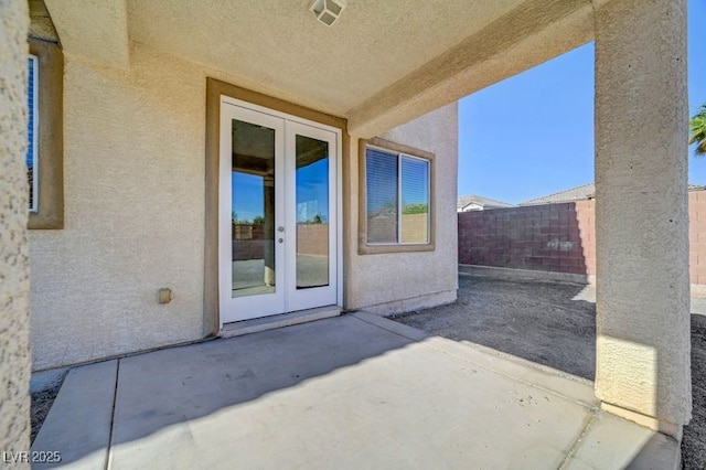 2261 Dalton Ridge Ct, North Las Vegas, NV 89031 - fenced backyard with french doors and a patio area