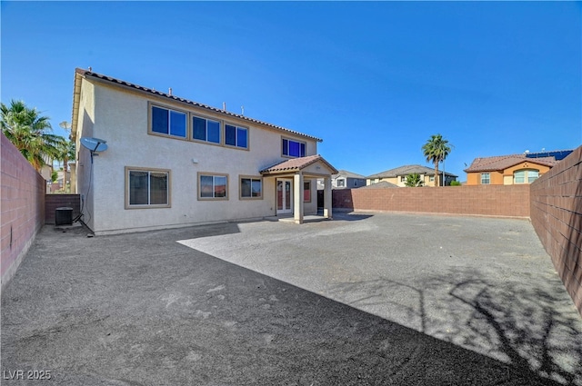 2261 Dalton Ridge Ct, North Las Vegas, NV 89031 - back of house featuring a fenced backyard, a patio, and stucco siding