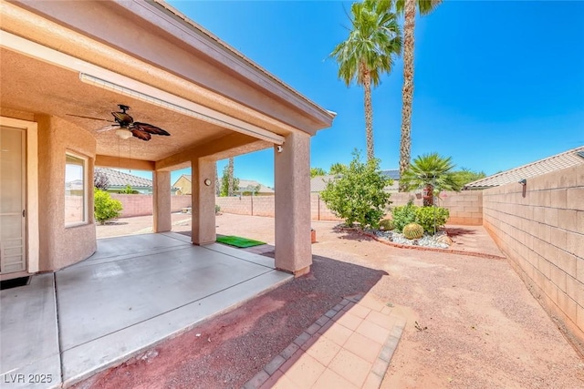 7606 Kenwood Hills Ct, Las Vegas, NV 89131 - fenced backyard featuring ceiling fan and a patio