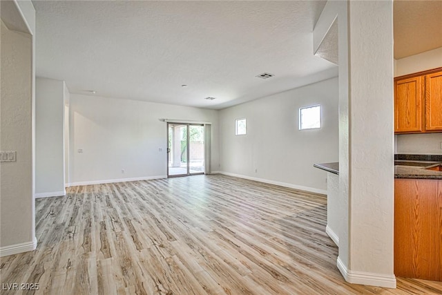 5967 Sun Appello Ave, Las Vegas, NV 89122 - empty room with light wood finished floors and plenty of natural light
