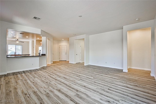 5967 Sun Appello Ave, Las Vegas, NV 89122 - unfurnished living room featuring wood finished floors and a ceiling fan