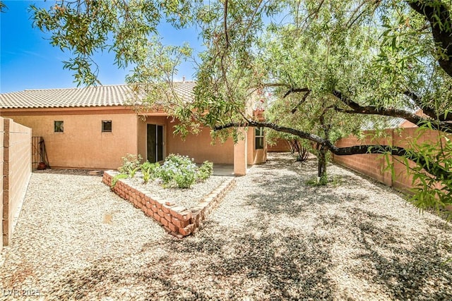 5967 Sun Appello Ave, Las Vegas, NV 89122 - back of property with stucco siding, a fenced backyard, a patio, and a tiled roof