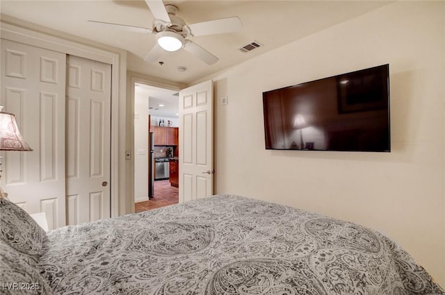 2405 W Serene Ave Unit 612, Las Vegas, NV 89123 - tiled bedroom featuring a closet and a ceiling fan