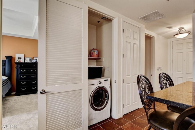 2405 W Serene Ave Unit 612, Las Vegas, NV 89123 - laundry area with washer / dryer and dark tile patterned flooring