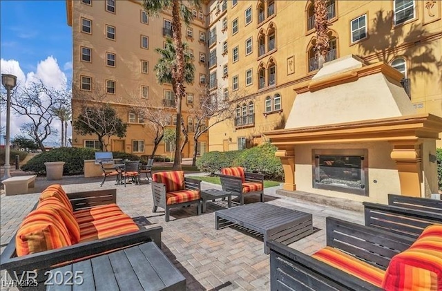 2405 W Serene Ave Unit 612, Las Vegas, NV 89123 - view of patio / terrace featuring an outdoor living space with a fireplace