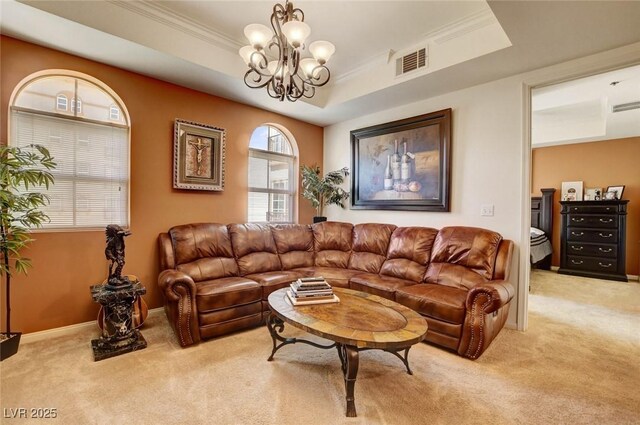 2405 W Serene Ave Unit 612, Las Vegas, NV 89123 - living room featuring light carpet, a raised ceiling, a chandelier, and crown molding