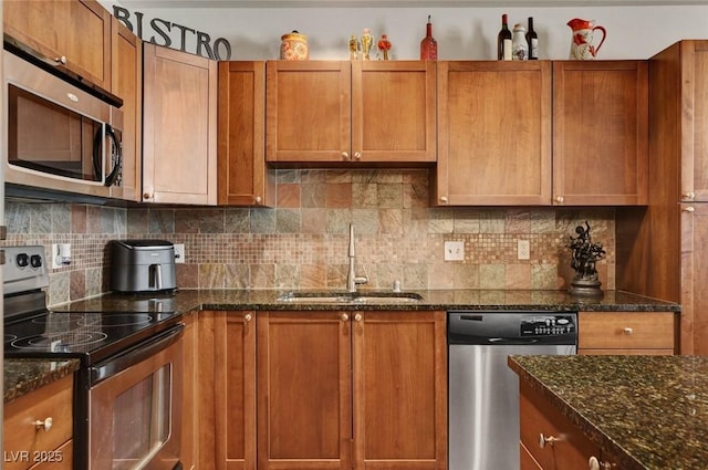 2405 W Serene Ave Unit 612, Las Vegas, NV 89123 - kitchen with stainless steel appliances, dark stone counters, and decorative backsplash