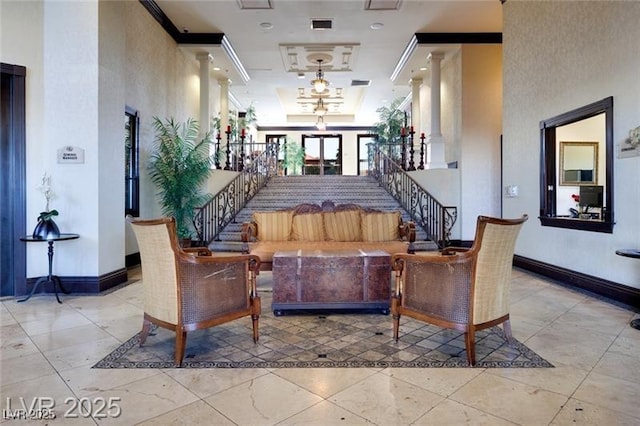 2405 W Serene Ave Unit 612, Las Vegas, NV 89123 - building lobby featuring stairs, a towering ceiling, and crown molding