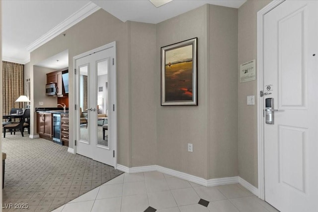 135 E Harmon Ave Unit 3816, Las Vegas, NV 89109 - foyer entrance with light tile patterned floors and crown molding