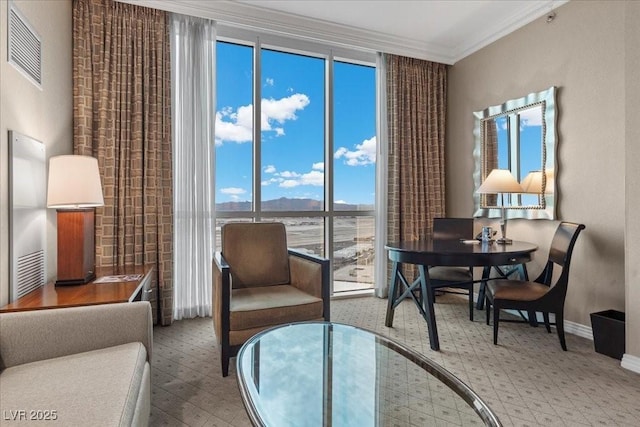 135 E Harmon Ave Unit 3816, Las Vegas, NV 89109 - sitting room featuring crown molding, a mountain view, and floor to ceiling windows