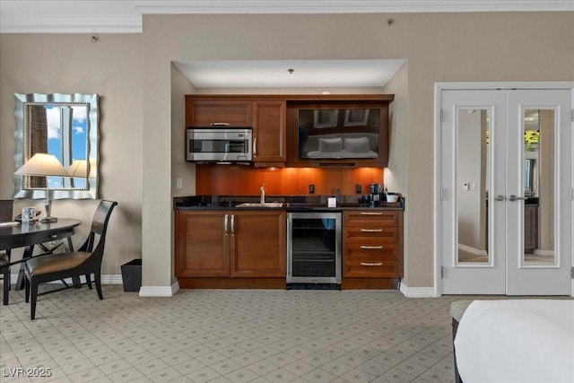 135 E Harmon Ave Unit 3816, Las Vegas, NV 89109 - indoor bar with wine cooler, stainless steel microwave, french doors, and ornamental molding