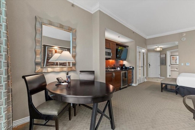 135 E Harmon Ave Unit 3816, Las Vegas, NV 89109 - dining space with ornamental molding and beverage cooler