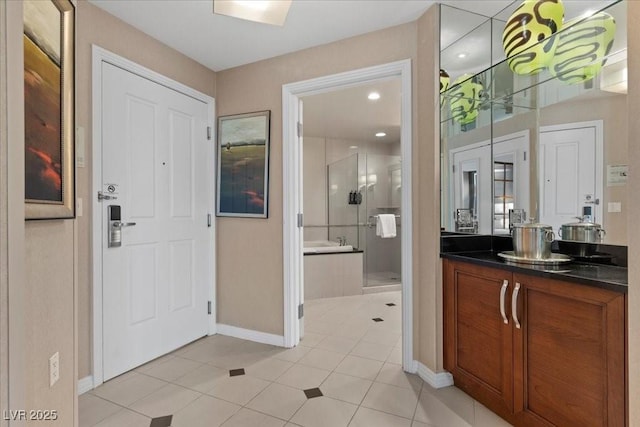 135 E Harmon Ave Unit 3816, Las Vegas, NV 89109 - bathroom featuring a stall shower, vanity, and tile patterned floors