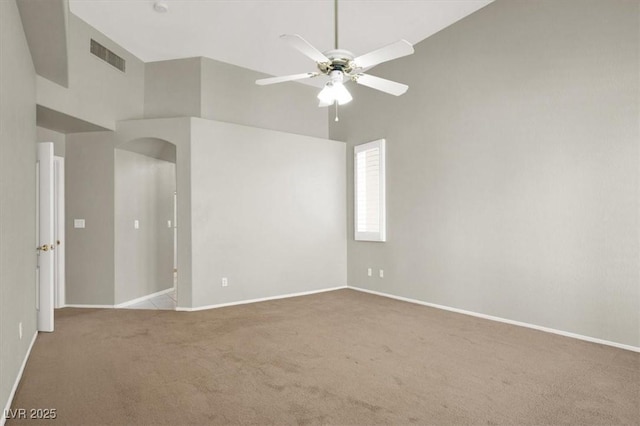 8612 Chiquita Dr, Las Vegas, NV 89128 - unfurnished room with arched walkways, ceiling fan, carpet, and a towering ceiling