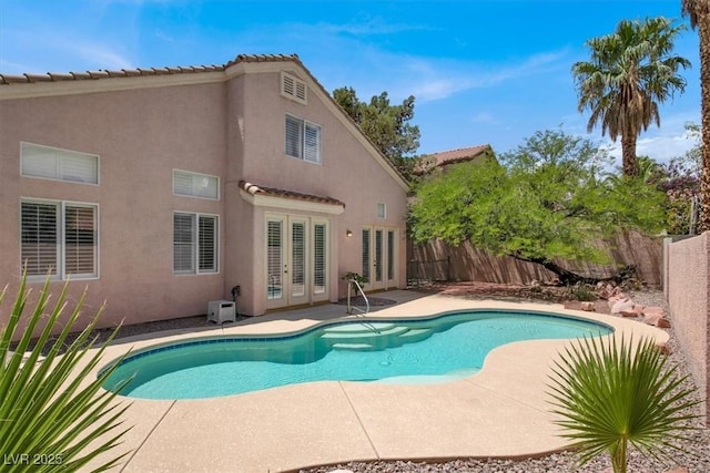 8612 Chiquita Dr, Las Vegas, NV 89128 - view of swimming pool with french doors, a fenced backyard, and a patio area