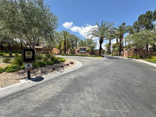 8612 Chiquita Dr, Las Vegas, NV 89128 - view of street featuring curbs, a gated entry, and a residential view