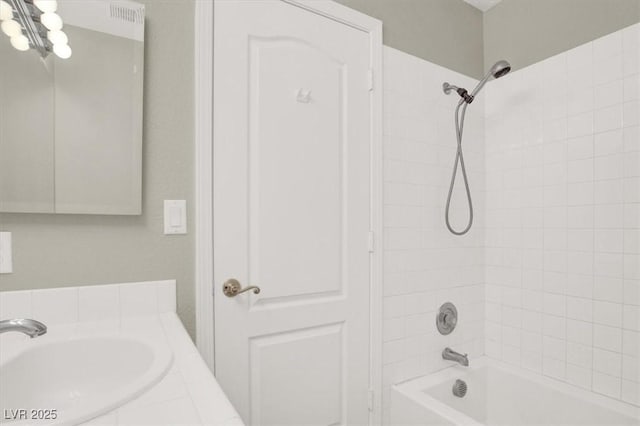 8612 Chiquita Dr, Las Vegas, NV 89128 - bathroom with bathtub / shower combination, vanity, and a chandelier