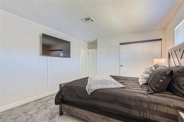 3047 Van Buskirk Cir, Las Vegas, NV 89121 - carpeted bedroom with a closet and a textured ceiling
