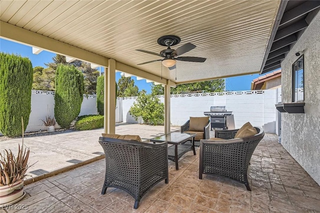 3047 Van Buskirk Cir, Las Vegas, NV 89121 - fenced backyard with ceiling fan, a patio, area for grilling, and an outdoor living space