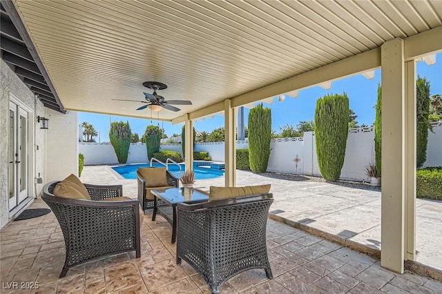 3047 Van Buskirk Cir, Las Vegas, NV 89121 - fenced backyard with ceiling fan and a patio