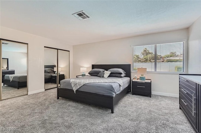 3047 Van Buskirk Cir, Las Vegas, NV 89121 - bedroom featuring multiple closets and light carpet
