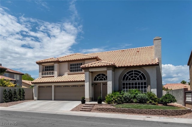 8820 Fall Green Ave, Las Vegas, NV 89129 - mediterranean / spanish-style home featuring stucco siding, driveway, a tiled roof, and an attached garage