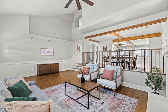 8820 Fall Green Ave, Las Vegas, NV 89129 - living area with a chandelier, a ceiling fan, stairs, wood finished floors, and high vaulted ceiling