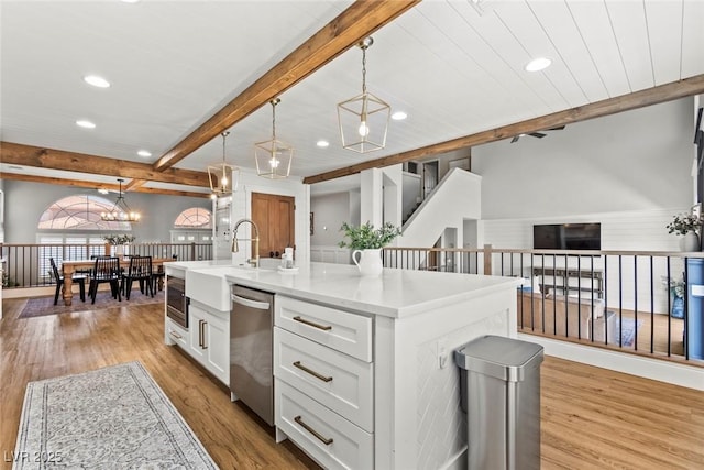 8820 Fall Green Ave, Las Vegas, NV 89129 - kitchen with dishwasher, beam ceiling, recessed lighting, light wood finished floors, and open floor plan
