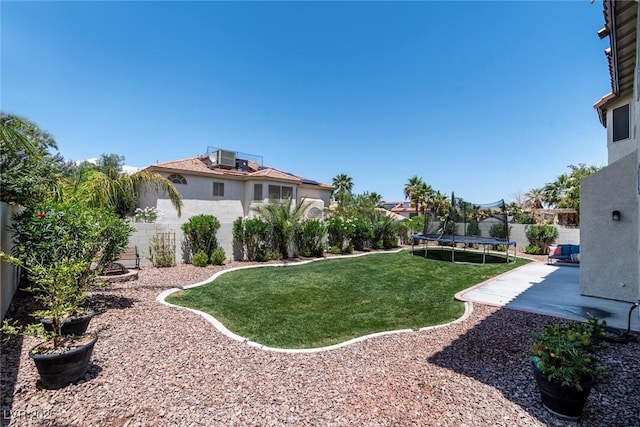 8820 Fall Green Ave, Las Vegas, NV 89129 - fenced backyard with a trampoline and a patio area