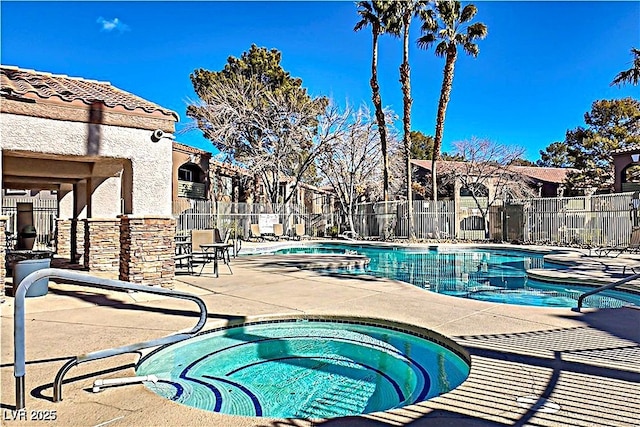 2101 Sealion Dr Unit 108, Las Vegas, NV 89128 - community pool featuring a community hot tub and a patio