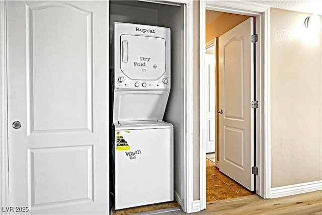 2101 Sealion Dr Unit 108, Las Vegas, NV 89128 - laundry room featuring estacked washer and dryer and tile patterned flooring