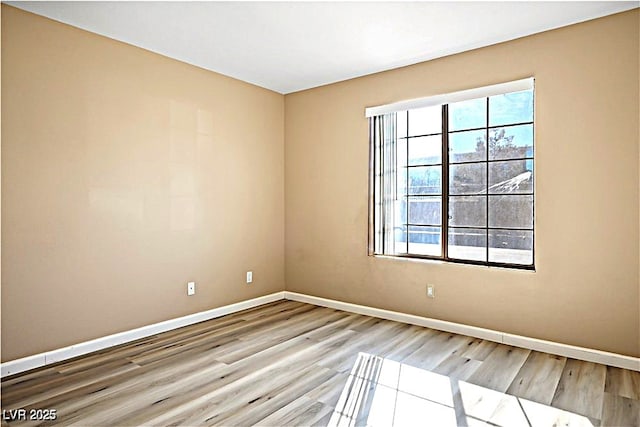 2101 Sealion Dr Unit 108, Las Vegas, NV 89128 - unfurnished room with wood finished floors and baseboards
