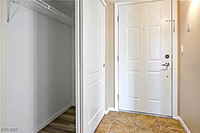2101 Sealion Dr Unit 108, Las Vegas, NV 89128 - doorway to outside with baseboards and tile patterned floors