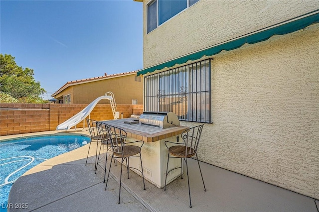 3624 Snowy Pines St, Las Vegas, NV 89147 - view of pool with a water slide and a patio