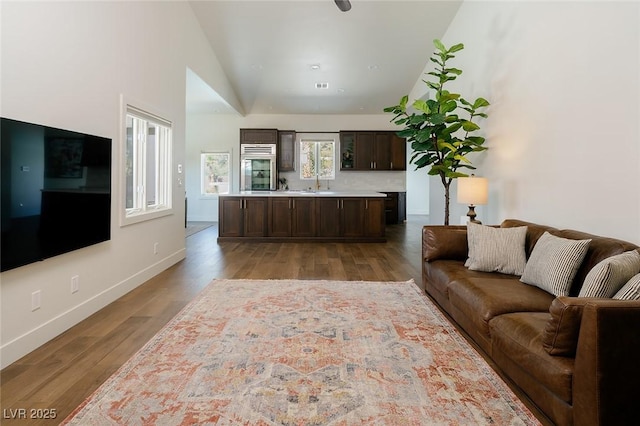 7745 Radcliff St, Las Vegas, NV 89123 - living area featuring wood finished floors and lofted ceiling